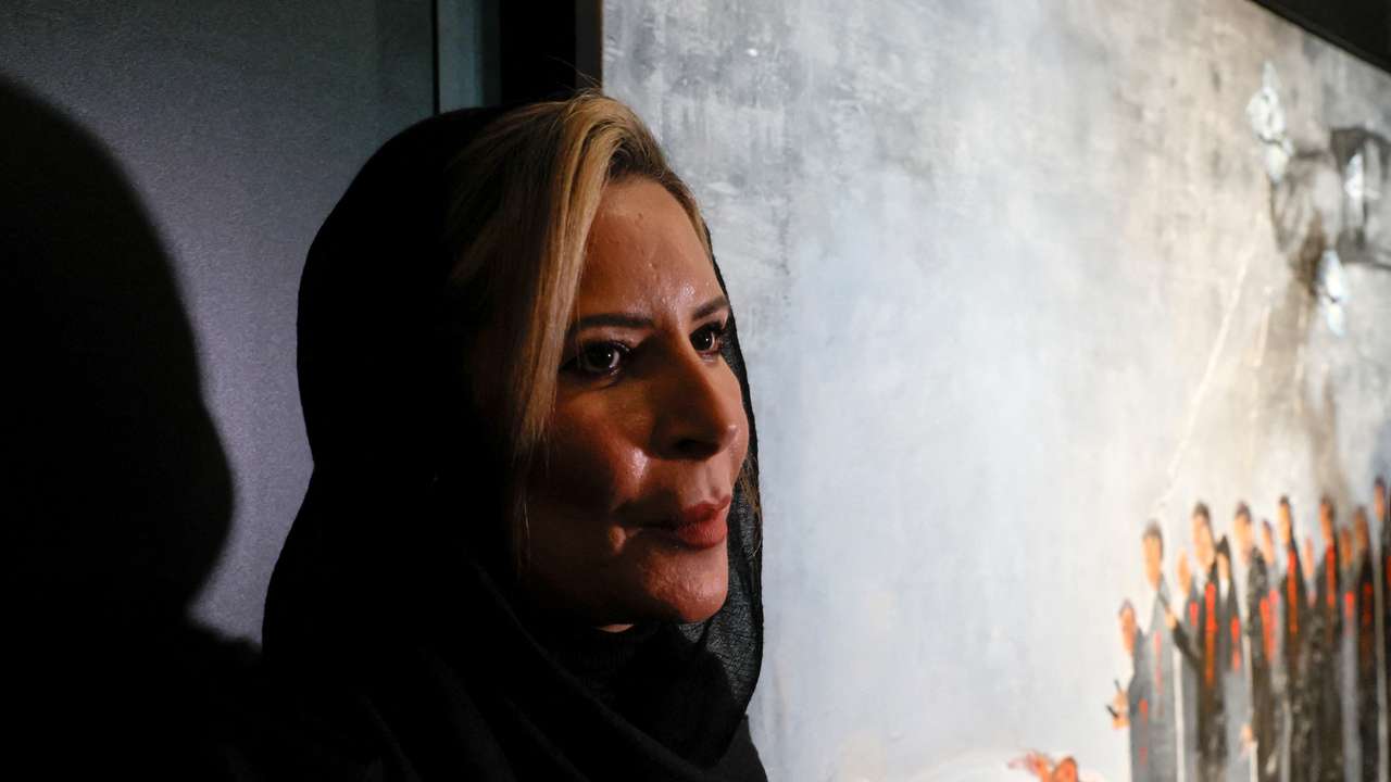 Aisha Gaddafi, daughter of Libya's former leader Muammar Gaddafi, attends an exhibition of her artworks in Moscow
