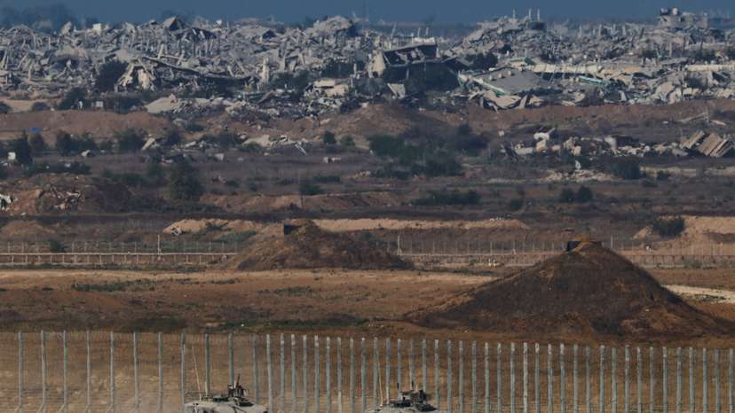 Israeli armoured personnel carriers (APC) manoeuvre on Israeli side of the Israel-Gaza border