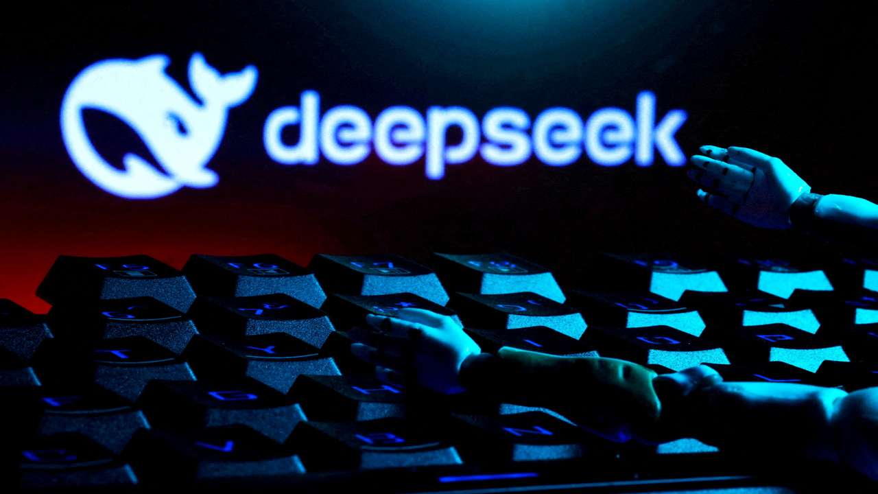 FILE PHOTO: FILE PHOTO: Illustration shows deepseek logo, keyboard, and robot hands