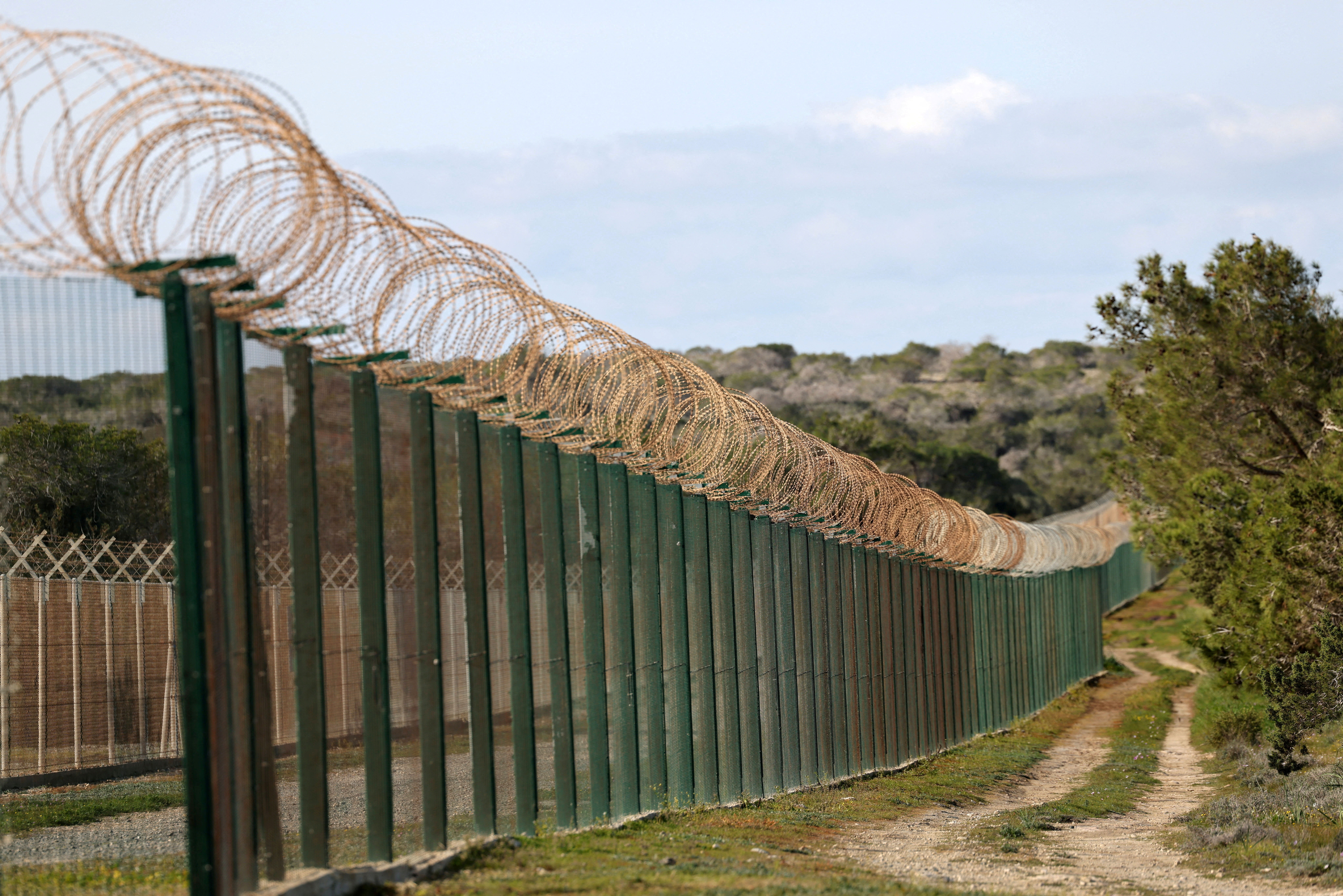 A fence at the entrance of RAF Akrotiri, a British sovereign base in Cyprus that was hit by a drone early Monday, causing limited damage