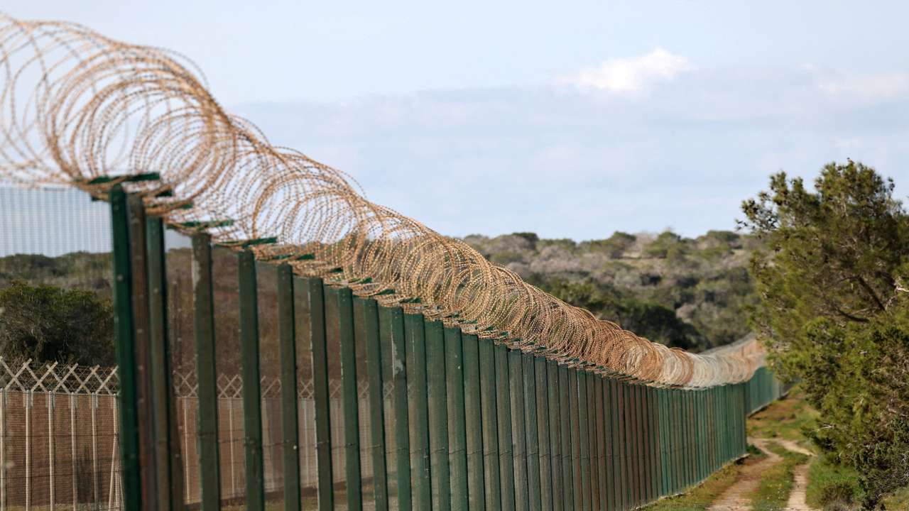 A fence at the entrance of RAF Akrotiri, a British sovereign base in Cyprus that was hit by a drone early Monday, causing limited damage