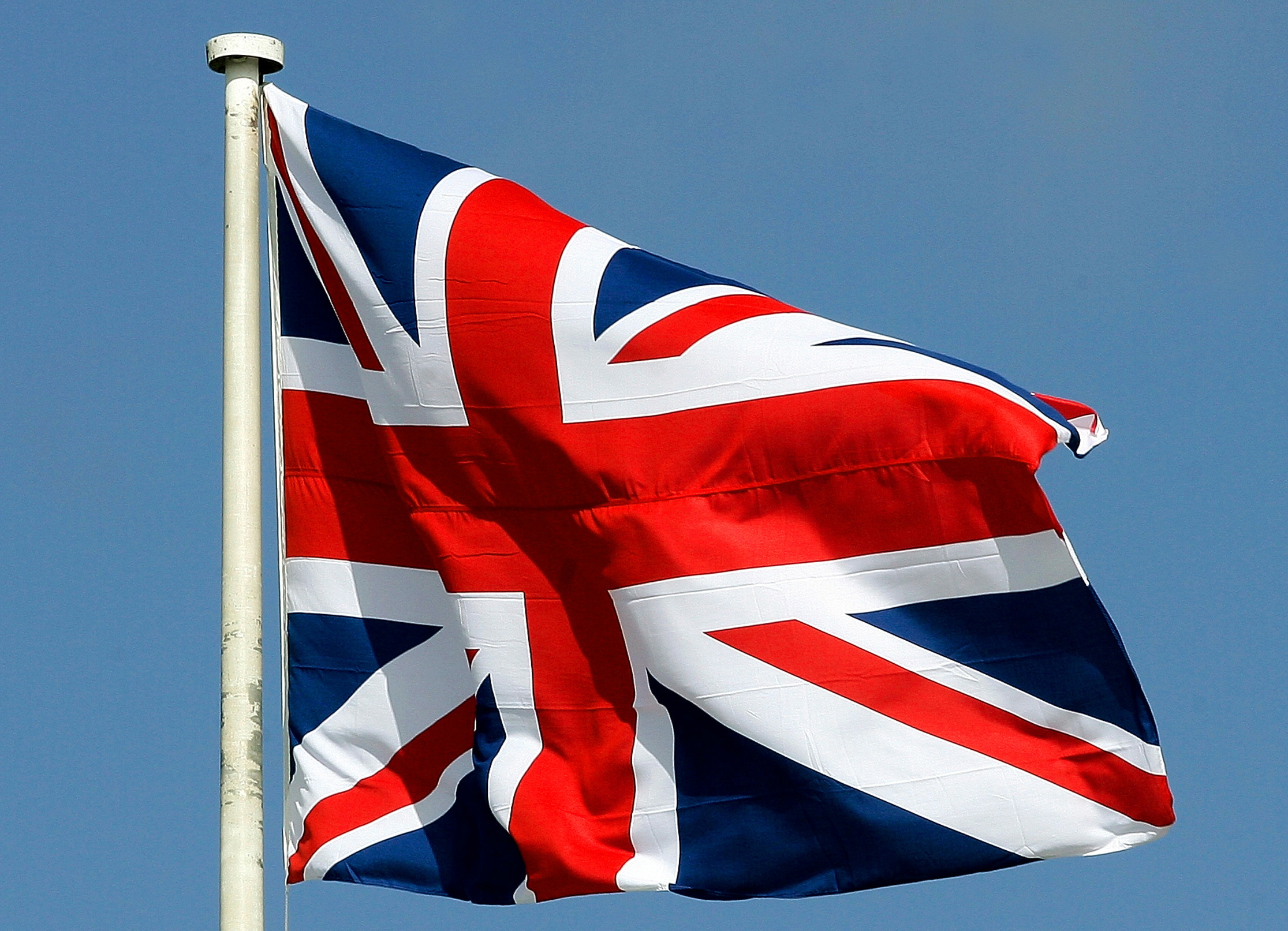 Britain's Union Flag, commonly known as the Union Jack, flutters in the wind before the Sovereign's ..