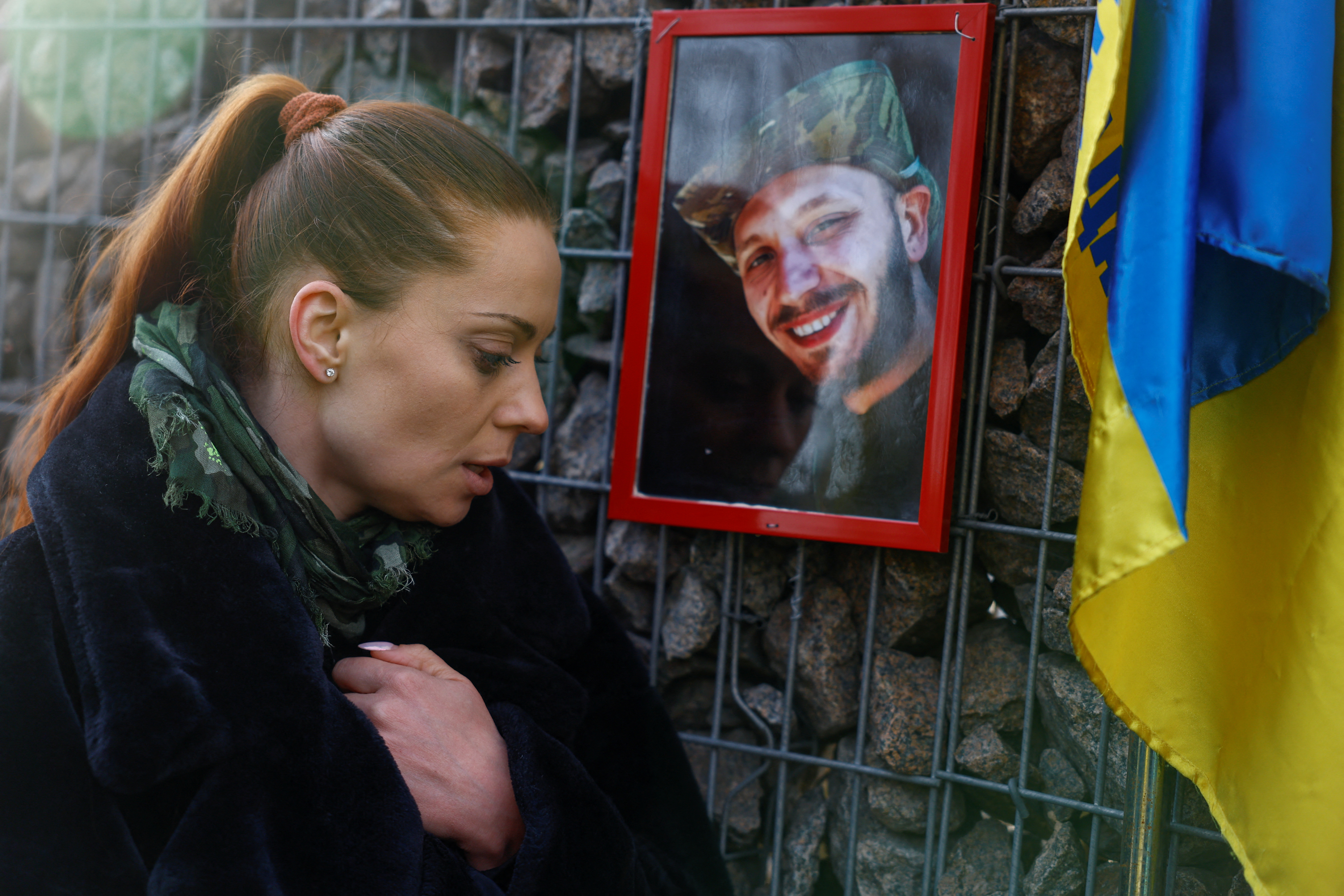 FILE PHOTO: Ukrainian actor Birzul visits a grave af her younger brother Krotov in Kyiv