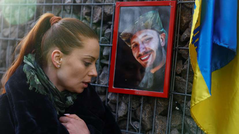 FILE PHOTO: Ukrainian actor Birzul visits a grave af her younger brother Krotov in Kyiv
