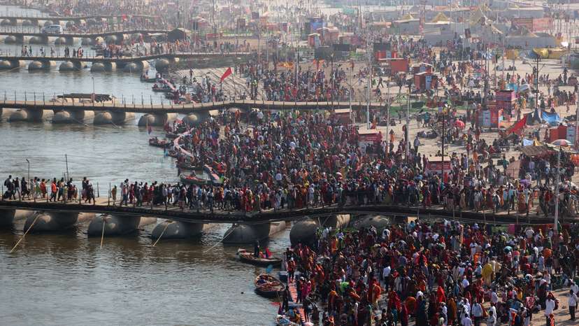 Devotees take a dip at Sangam during "Maha Kumbh Mela" in Prayagraj