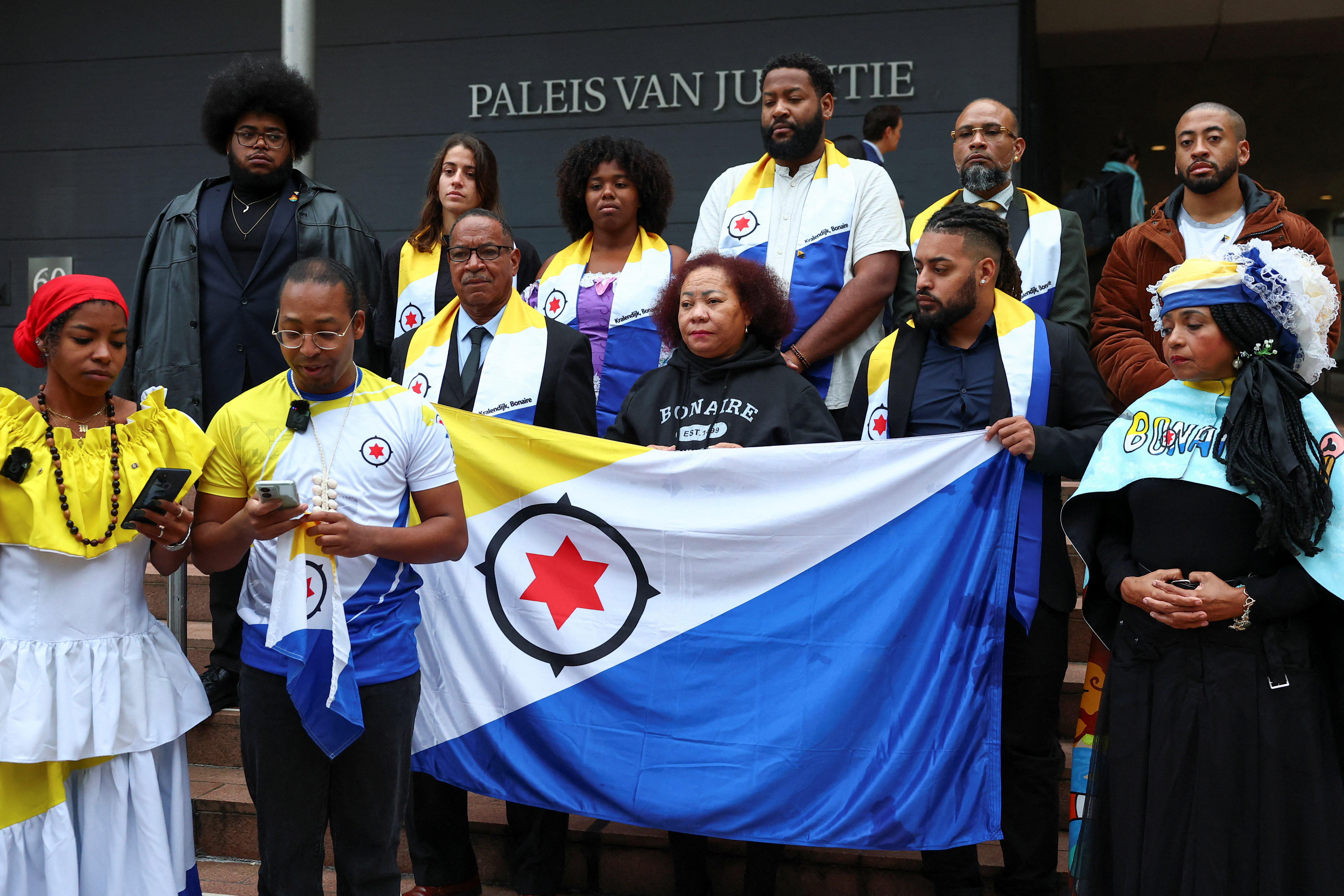 People protest in front of district court that hears case regarding Bonaire, in The Hague