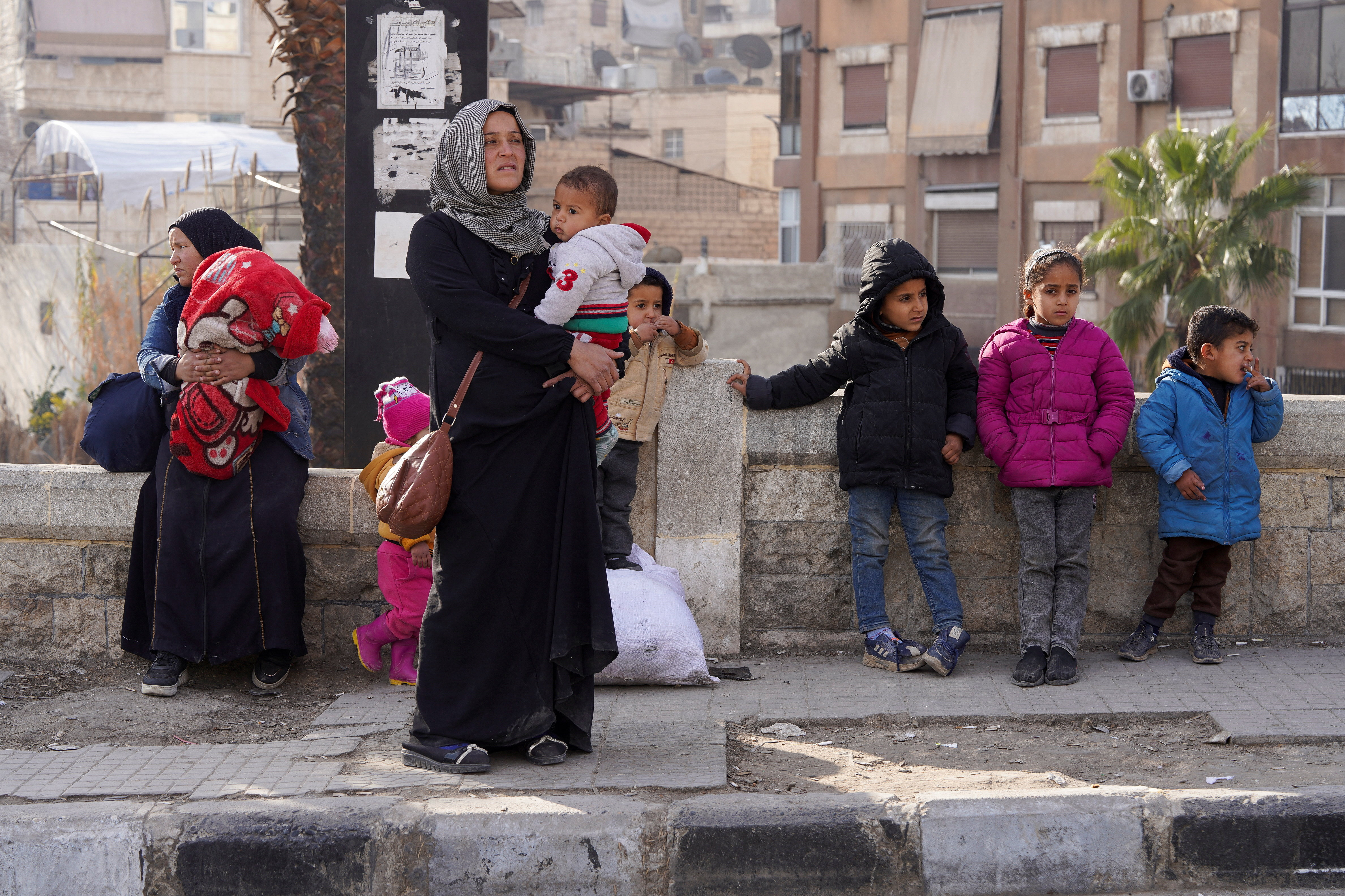 Civilians flee following renewed clashes between the Syrian army and the Syrian Democratic Forces (SDF)