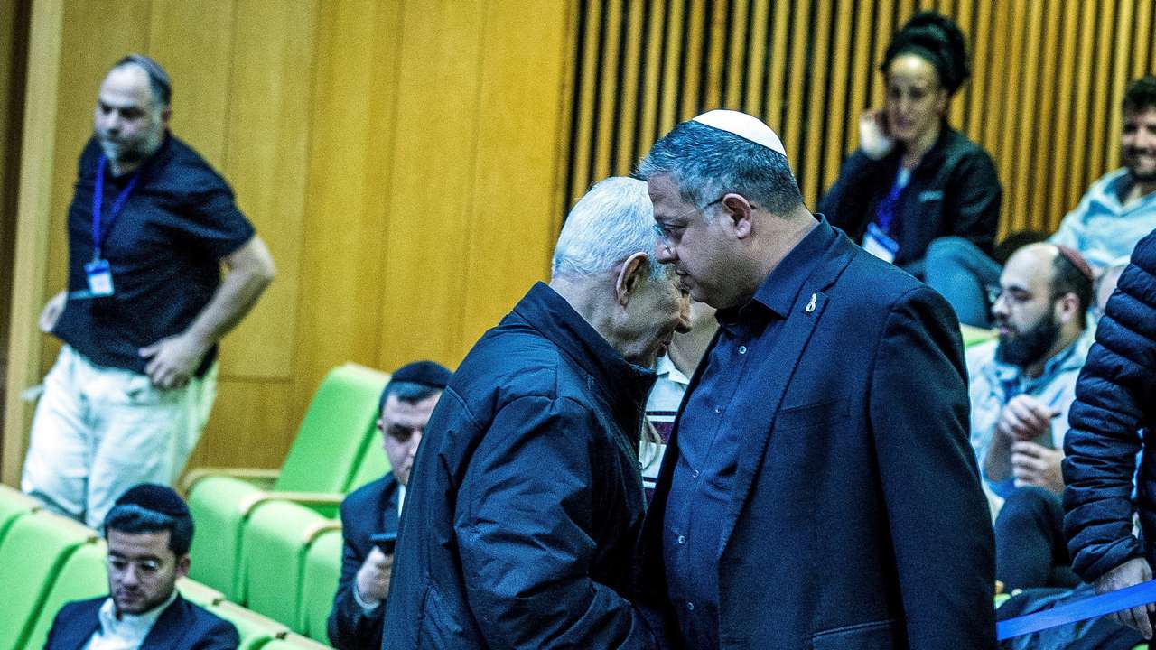 Israeli Prime Minister Benjamin Netanyahu and Israel's far-right National Security Minister Itamar Ben-Gvir shake hands as they attend a session at the Knesset, Israeli parliament, in Jerusalem