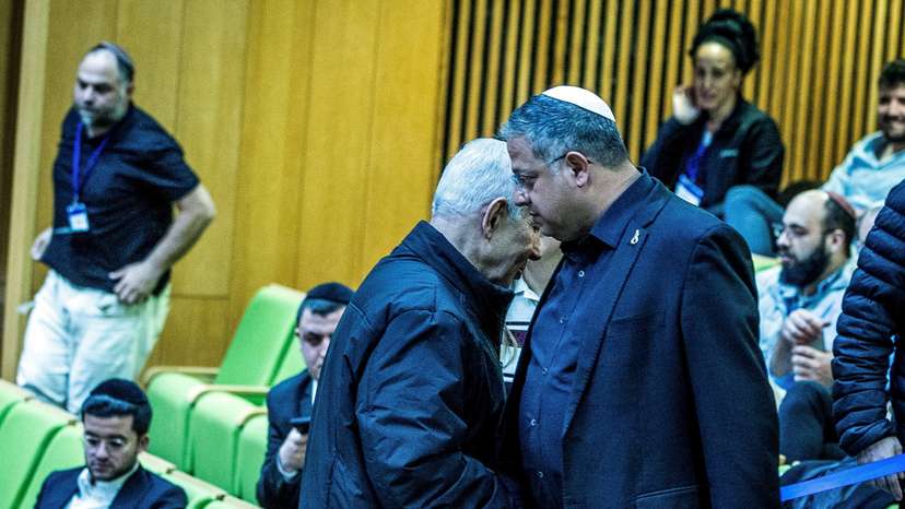 Israeli Prime Minister Benjamin Netanyahu and Israel's far-right National Security Minister Itamar Ben-Gvir shake hands as they attend a session at the Knesset, Israeli parliament, in Jerusalem