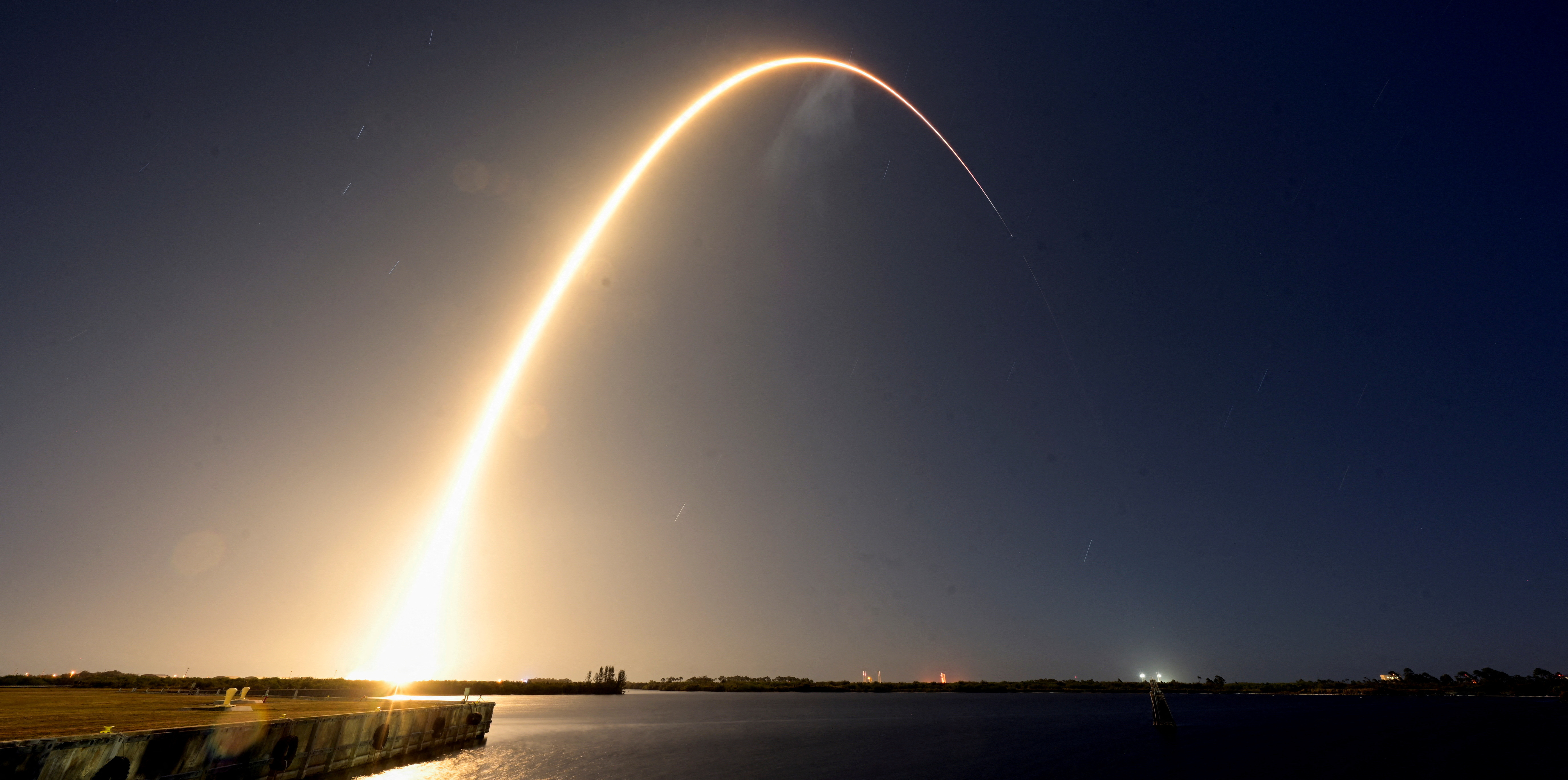 A SpaceX Falcon 9 rocket lifts off carrying two moon landers from the Kennedy Space Center
