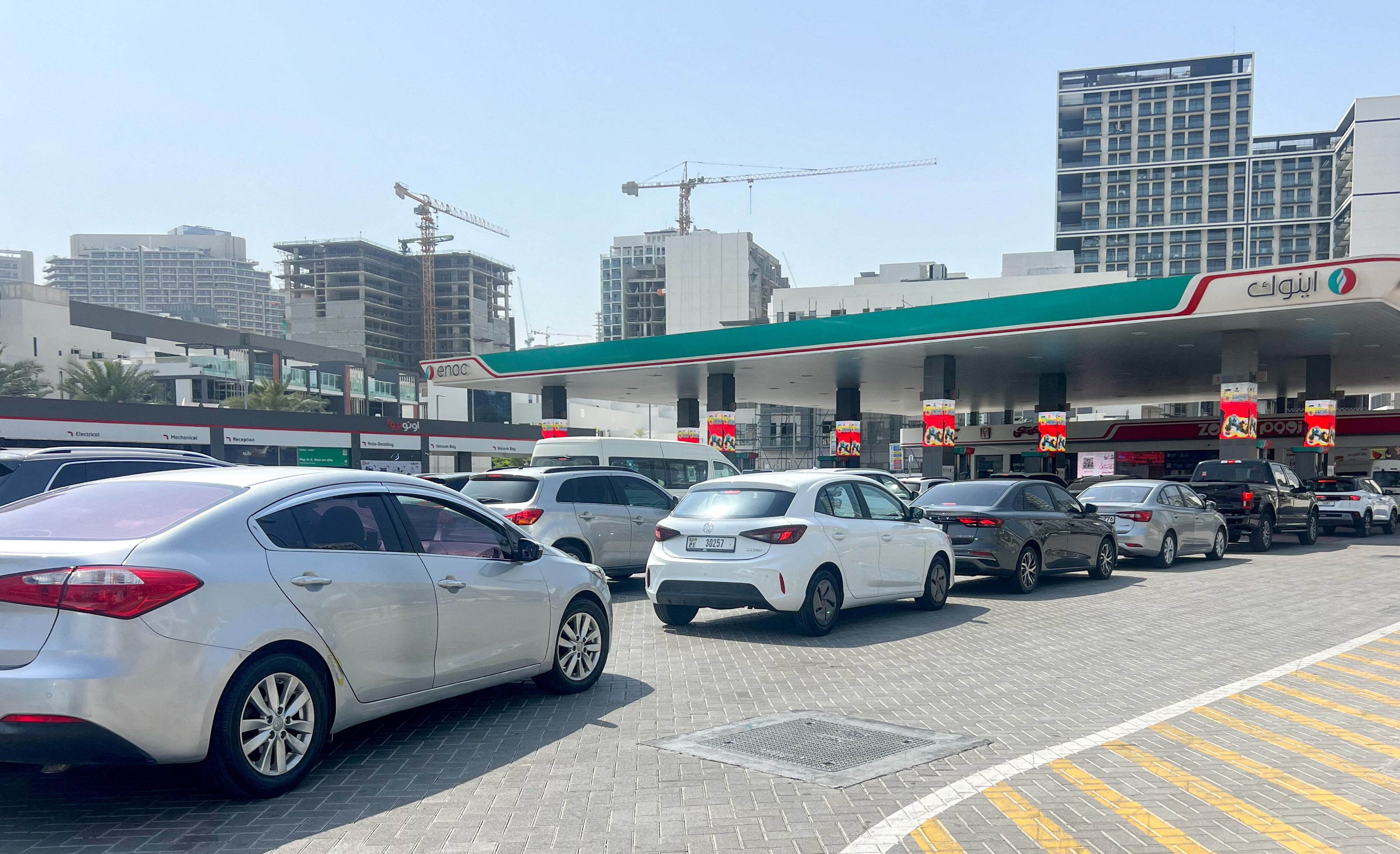 Cars queue outside a petrol station, after an Iranian attack, following United States and Israel strikes on Iran, in Dubai