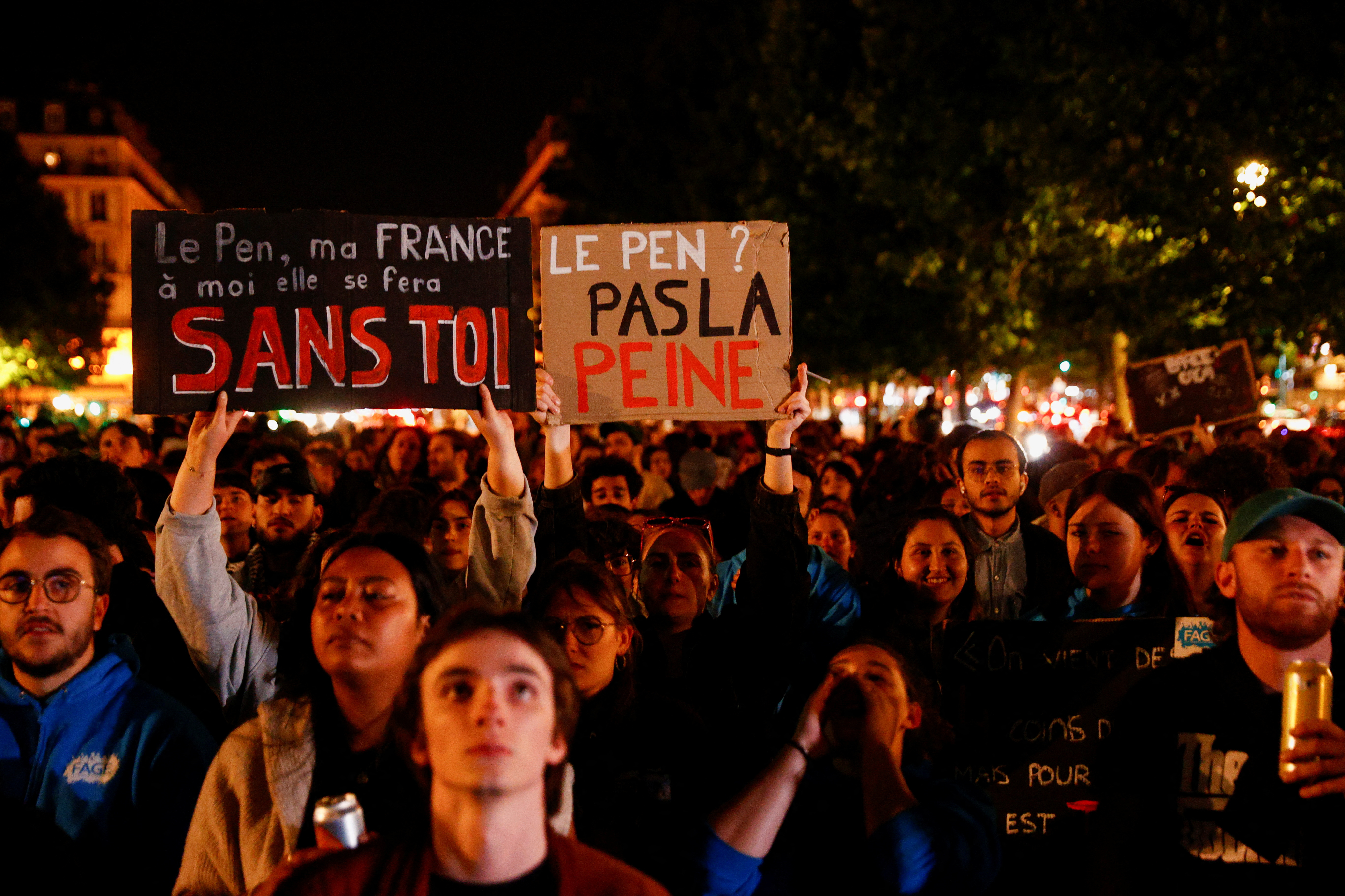 People gather on the Place de Republique following the results of the European elections, in Paris