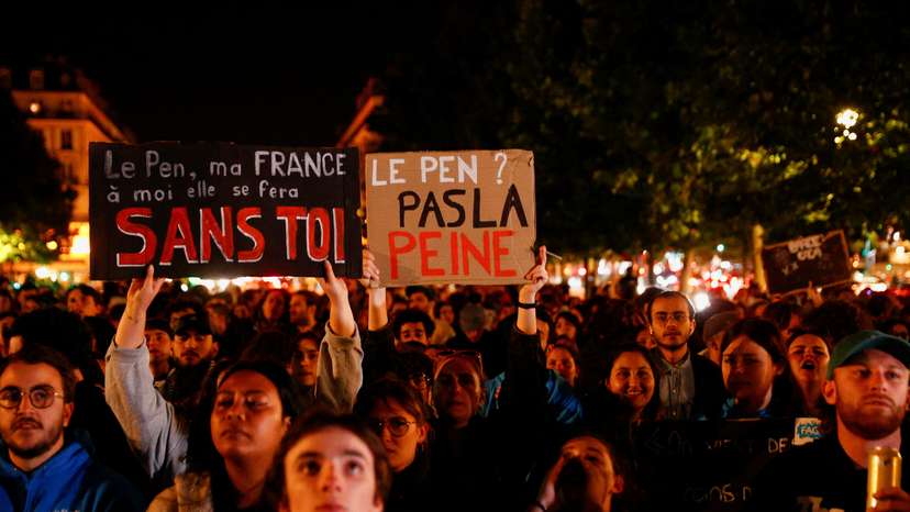 People gather on the Place de Republique following the results of the European elections, in Paris