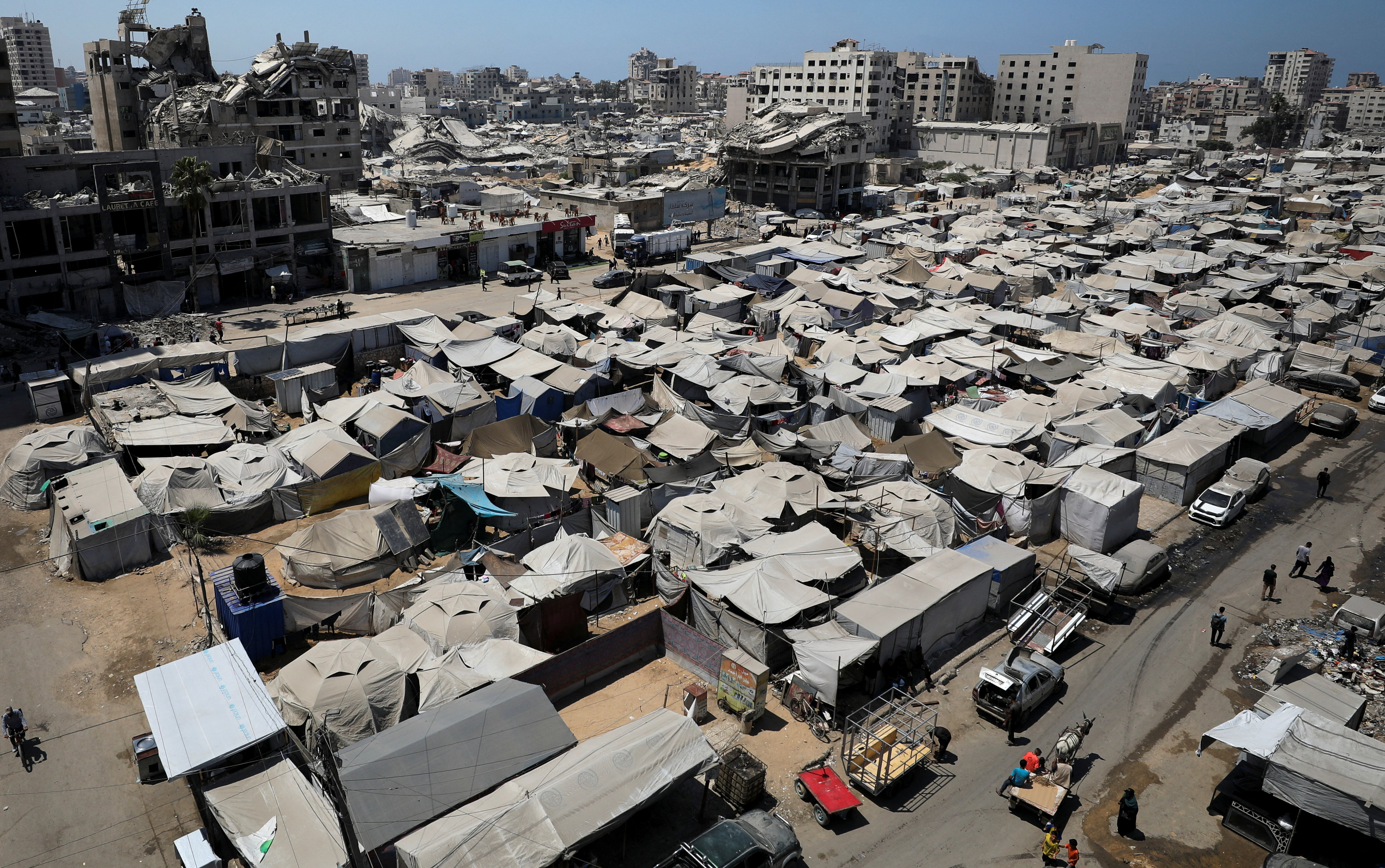 Palestinians displaced by the Israeli military offensive take shelter in tents, in Gaza City