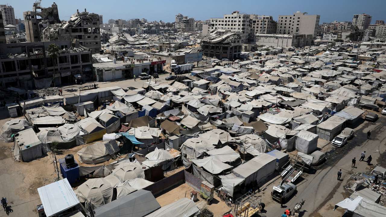 Palestinians displaced by the Israeli military offensive take shelter in tents, in Gaza City