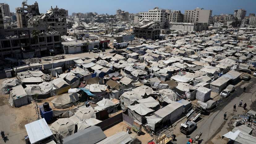 Palestinians displaced by the Israeli military offensive take shelter in tents, in Gaza City