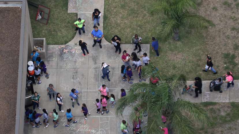 FILE PHOTO: Migrant children make their way inside a building at Casa Presidente, an immigrant shelter for unaccompanied minors, in Brownsville