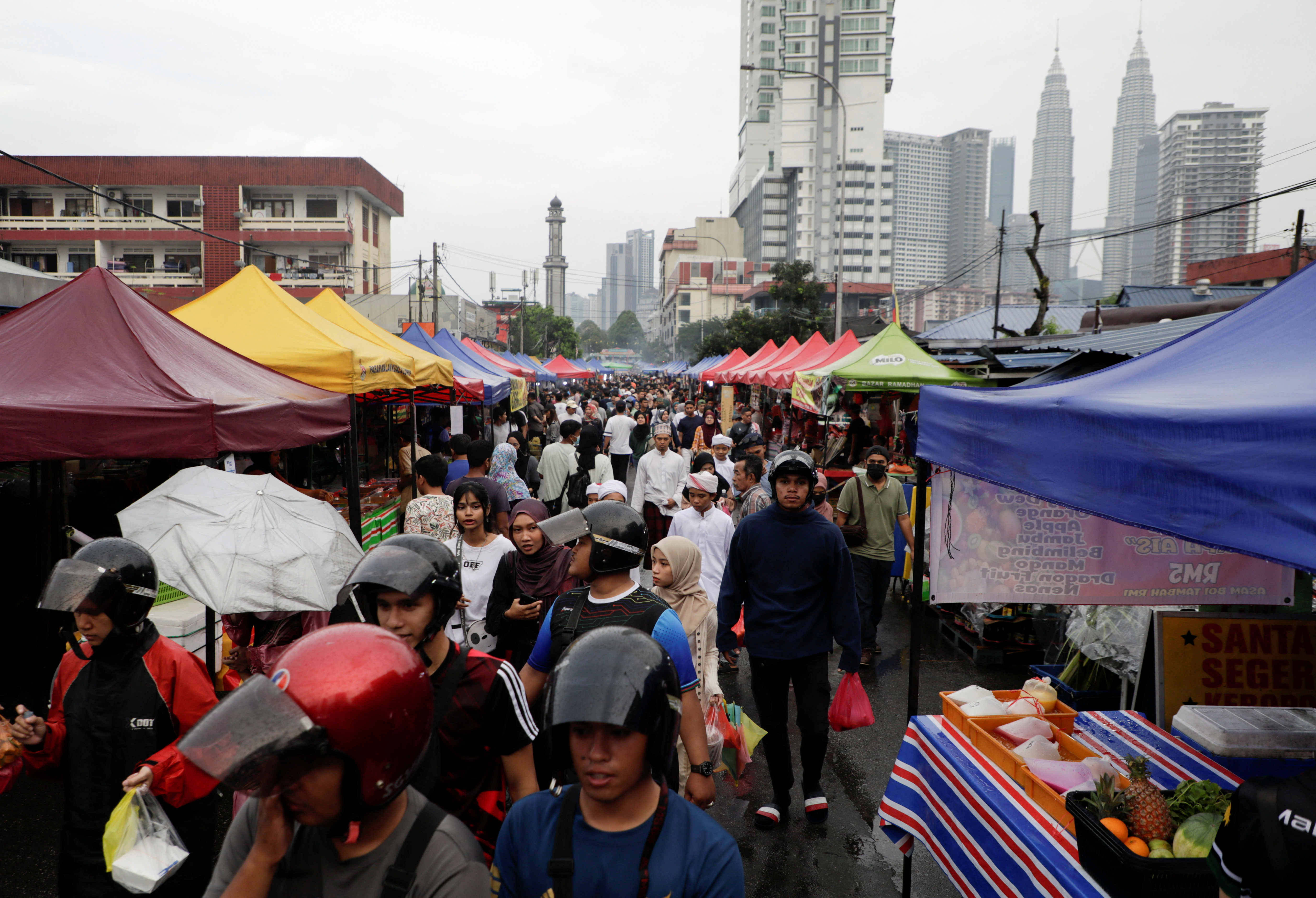 Muslims shop for food to break their fast at a bazaar during the holy month of Ramadan in Kuala Lumpur