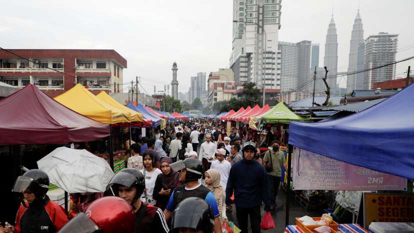 Muslims shop for food to break their fast at a bazaar during the holy month of Ramadan in Kuala Lumpur