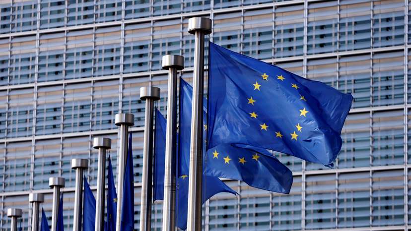 FILE PHOTO: EU flags flutter outside the EU Commission headquarters in Brussels