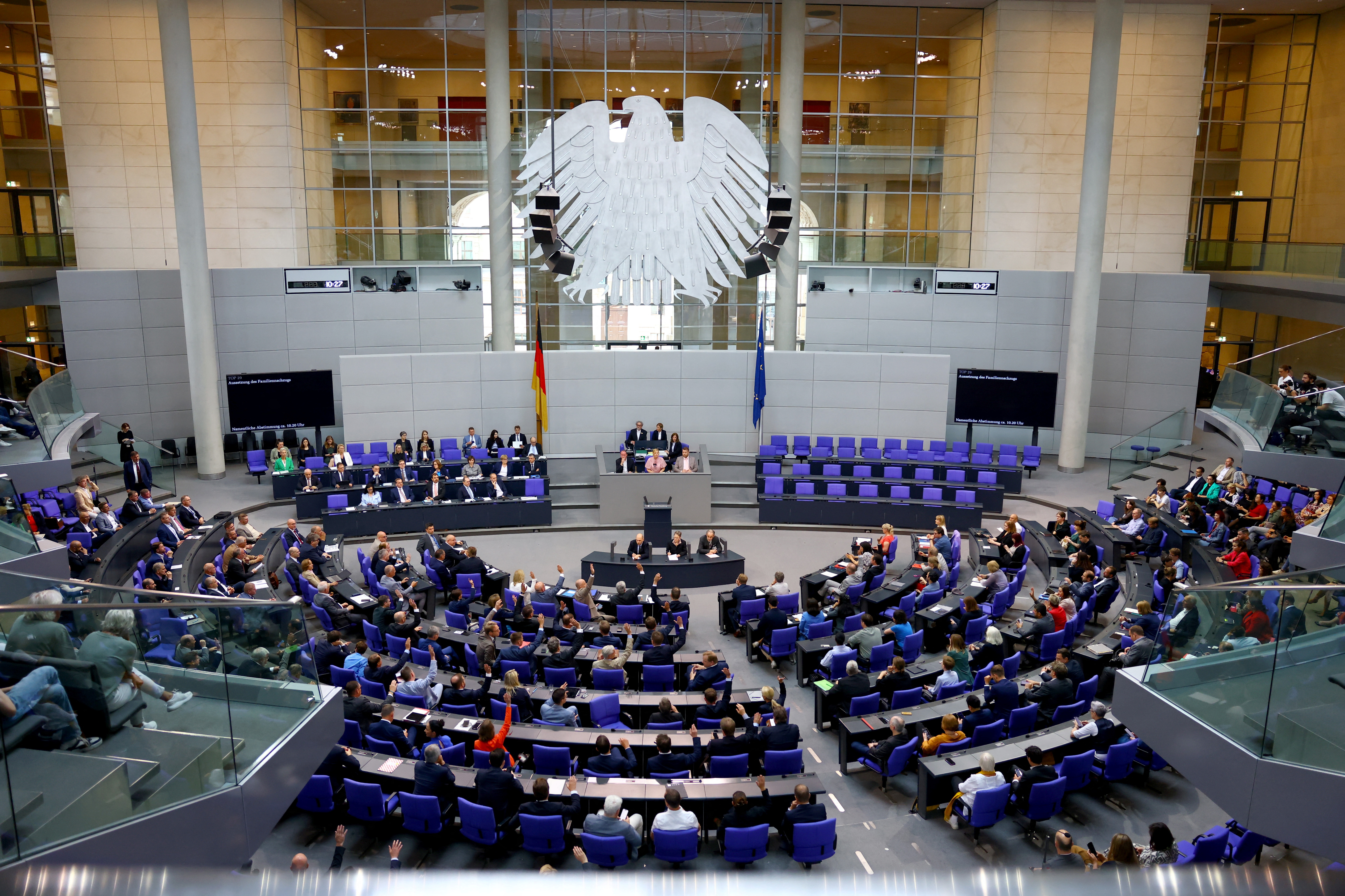 Members of the Bundestag vote during Germany's lower house session in Berlin