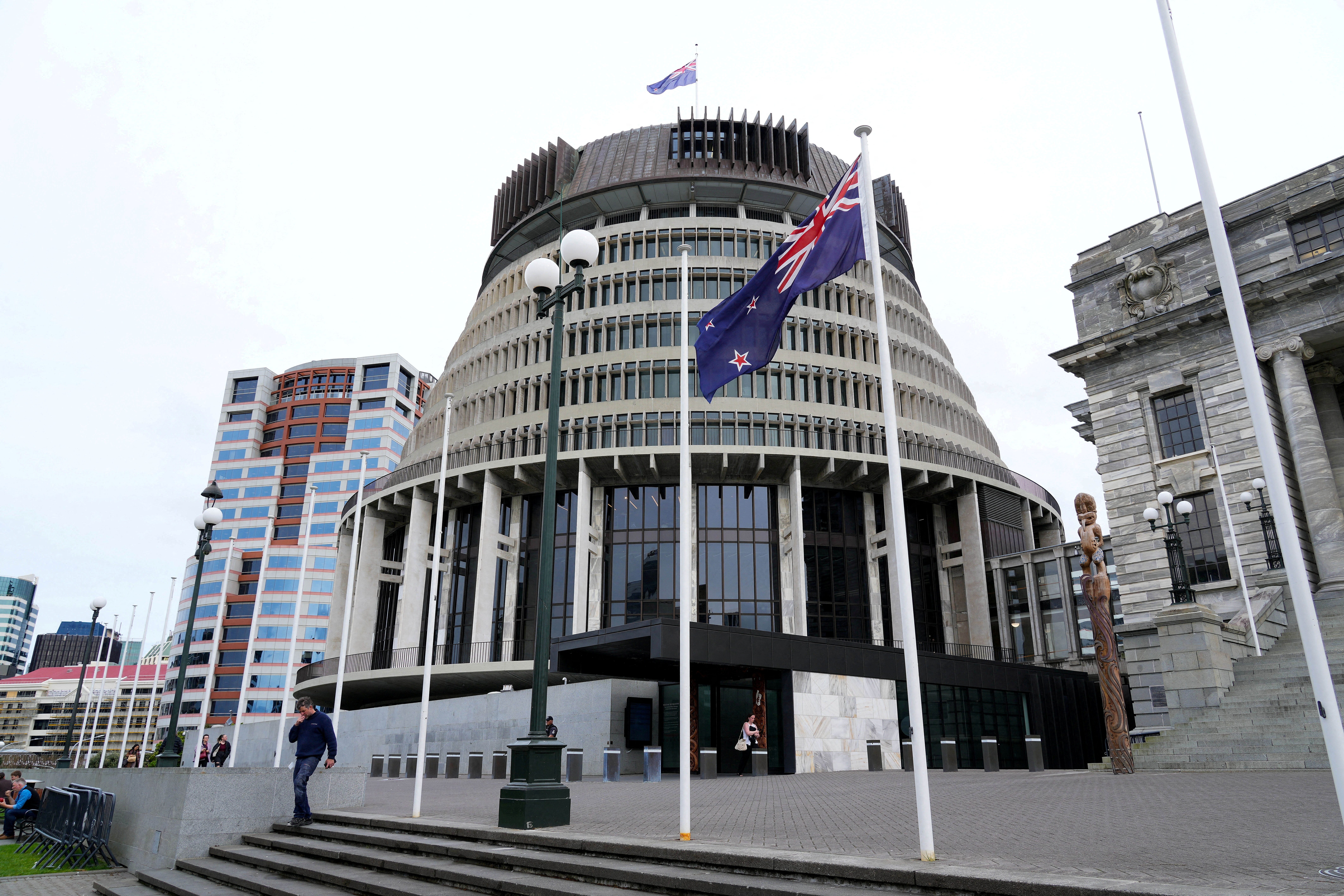 FILE PHOTO: New Zealand's flag flutters in front of 'The Beehive', the executive wing of the New Zealand Parliament Buildings, in Wellington