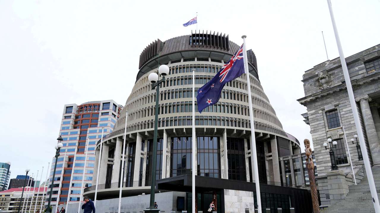 FILE PHOTO: New Zealand's flag flutters in front of 'The Beehive', the executive wing of the New Zealand Parliament Buildings, in Wellington