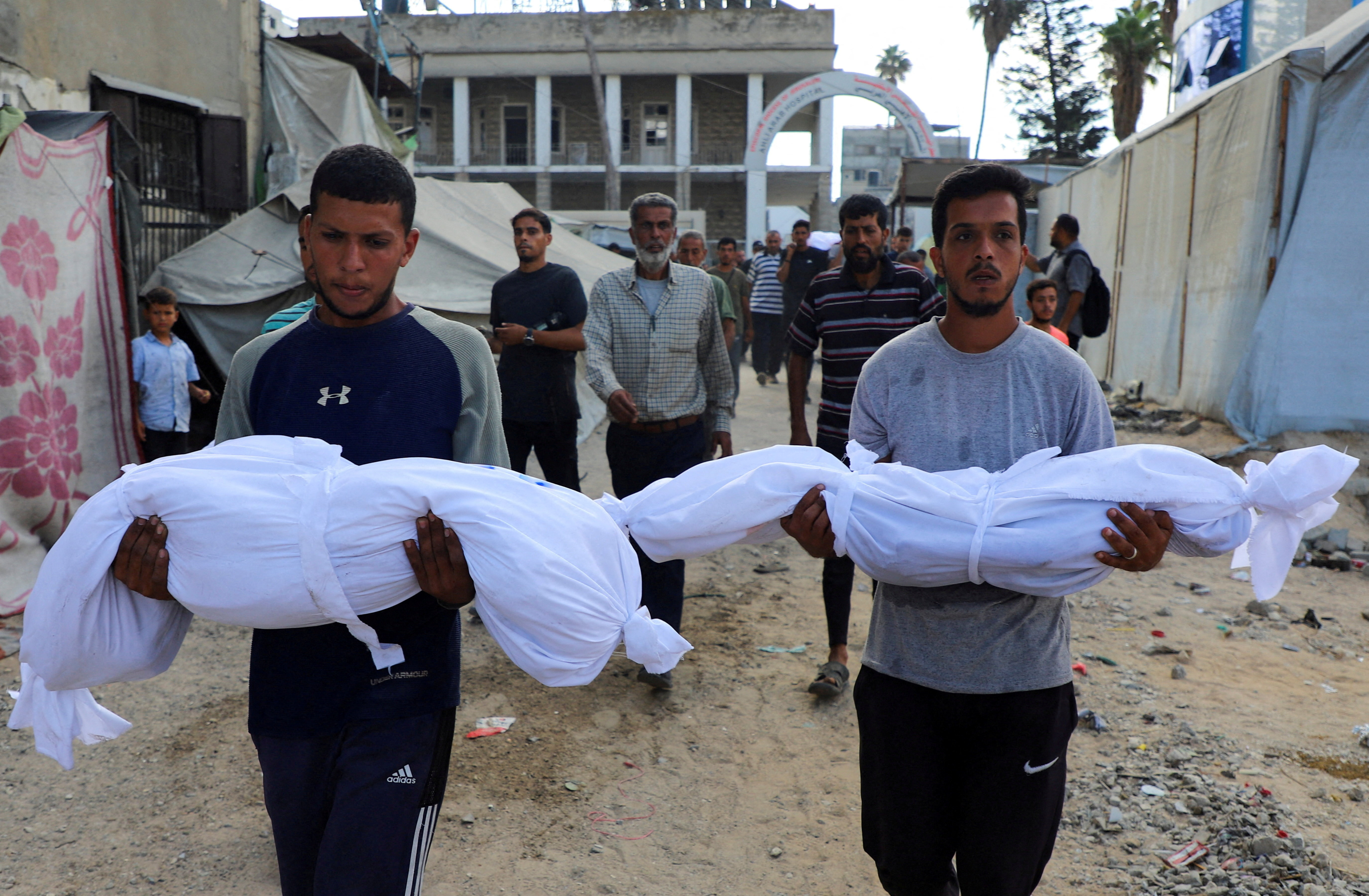 Aftermath of a deadly overnight Israeli strikes on a building where displaced people were taking shelter in Gaza City