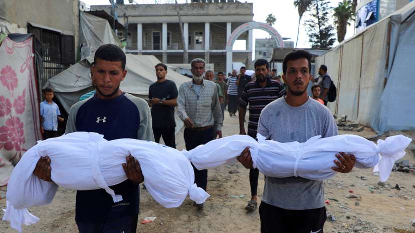 Aftermath of a deadly overnight Israeli strikes on a building where displaced people were taking shelter in Gaza City