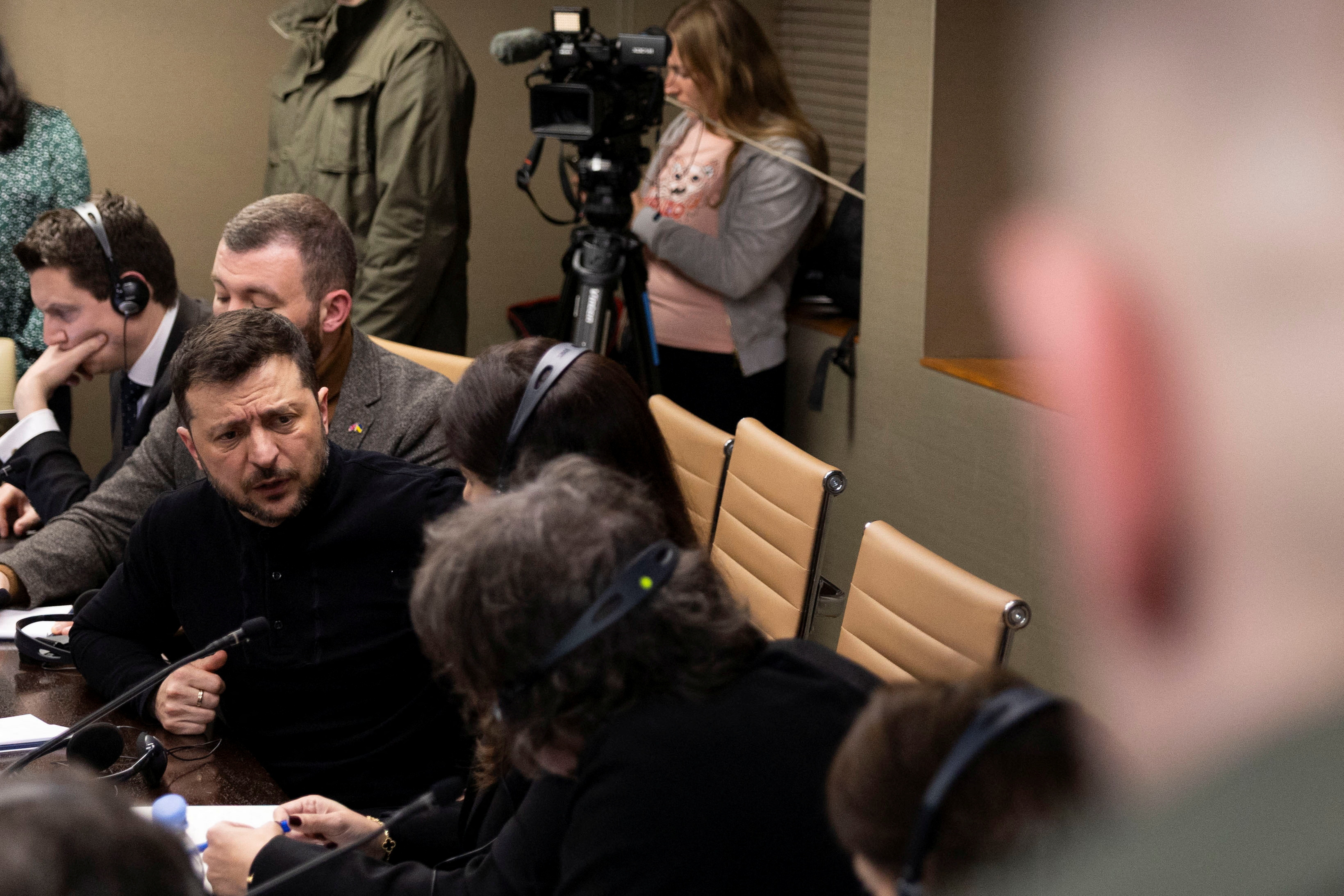 Ukrainian President Volodymyr Zelenskiy speaks during a meeting with members of the media on the outskirts of  London