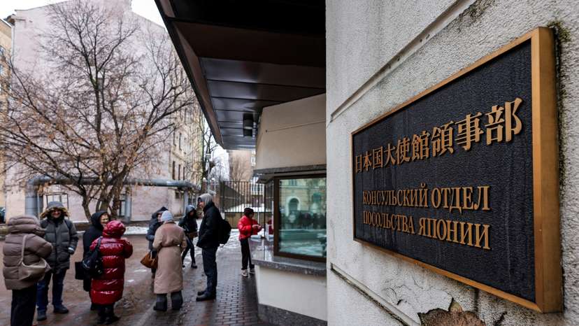 People queue outside the Japanese embassy in Moscow