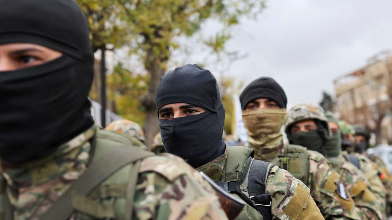 FILE PHOTO: Khaled Brigade, a part of Hay'at Tahrir al-Sham (HTS), hold a military parade, in Damascus