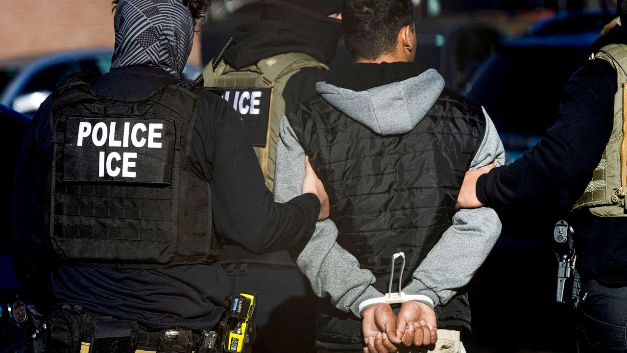FILE PHOTO: ICE and other federal agents conduct raids in Denver, Colorado