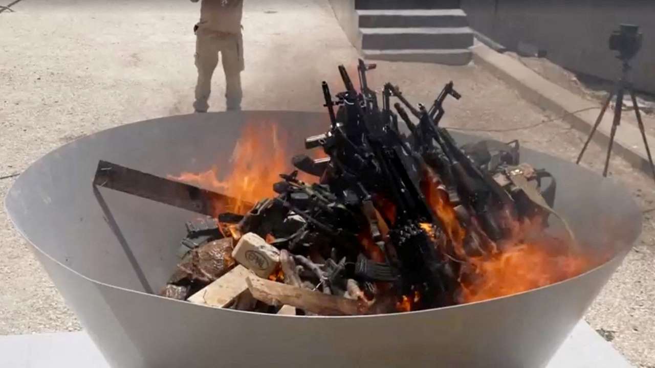 PKK fighters burn weapons during disarming ceremony in Iraqi Kurdistan