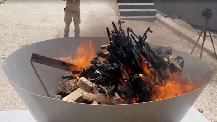 PKK fighters burn weapons during disarming ceremony in Iraqi Kurdistan