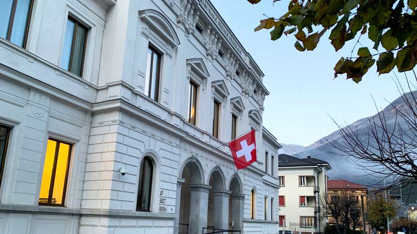 FILE PHOTO: Switzerland's national flag is displayed on the Swiss Federal Criminal Court building in Bellinzona