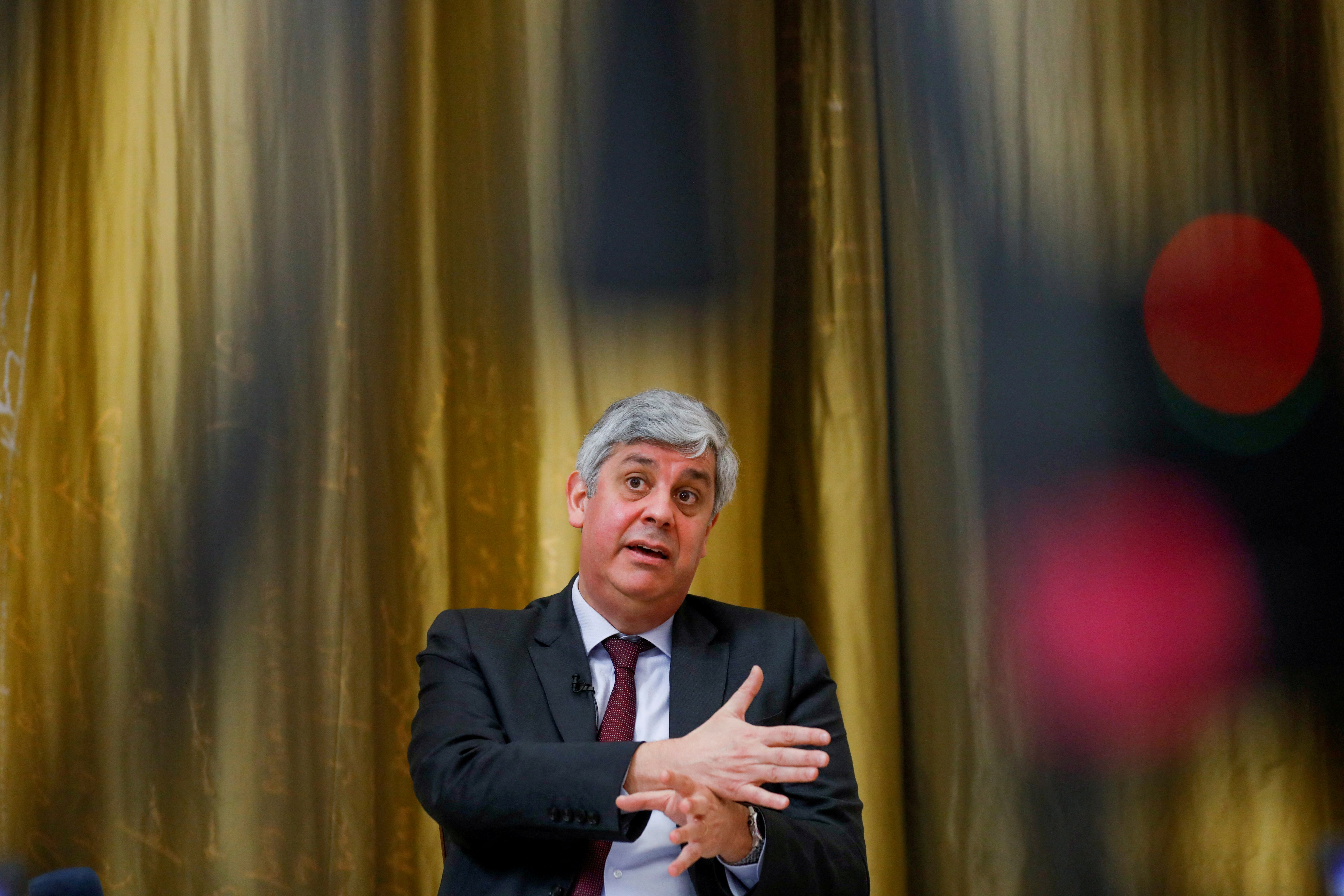 FILE PHOTO: ECB governing council member Mario Centeno speaks during an interview with Reuters, in Lisbon