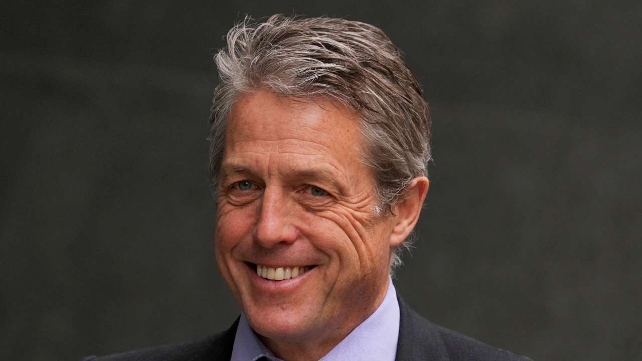 FILE PHOTO: Hugh Grant walks outside the High Court, in London