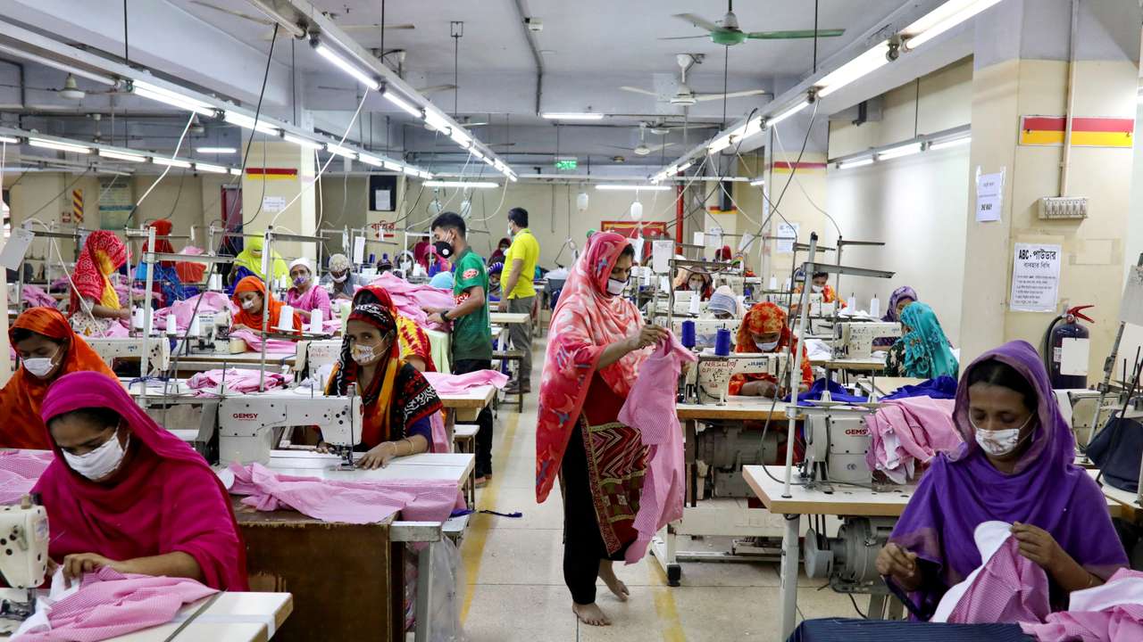FILE PHOTO: Women work in a garment factory, as factories reopened after the government has eased the restrictions amid concerns over coronavirus disease (COVID-19) outbreak in Dhaka