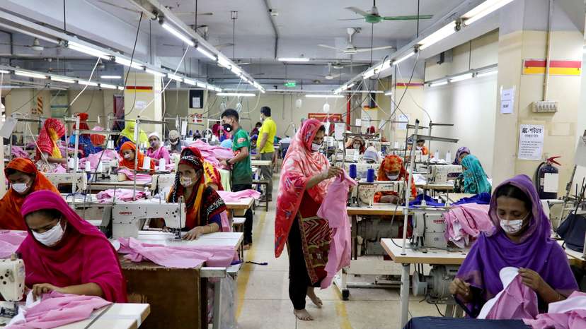 FILE PHOTO: Women work in a garment factory, as factories reopened after the government has eased the restrictions amid concerns over coronavirus disease (COVID-19) outbreak in Dhaka