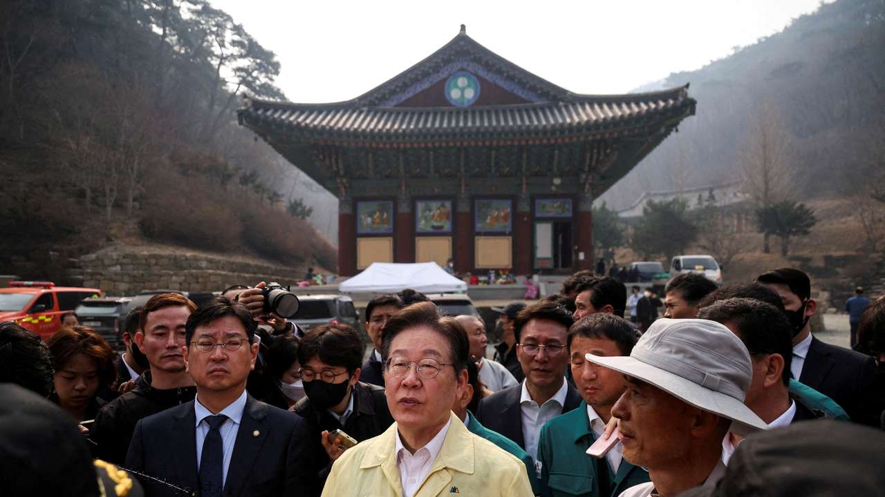 FILE PHOTO: Lee Jae-myung, leader of South Korea's main opposition Democratic Party, visits the devastated Gounsa temple in Uiseong