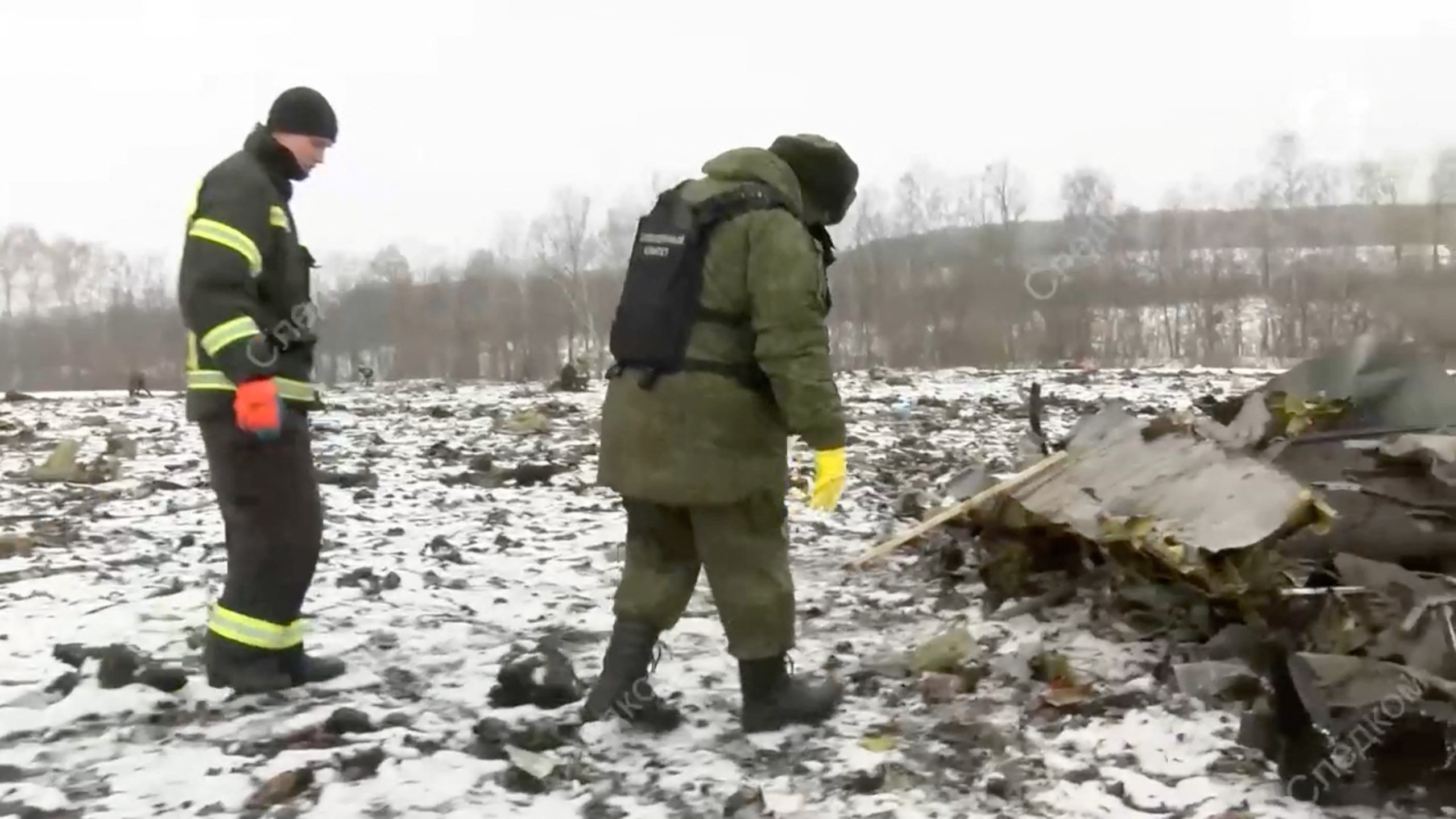 Investigators work at the crash site of Russian Il-76 military plane in Belgorod region