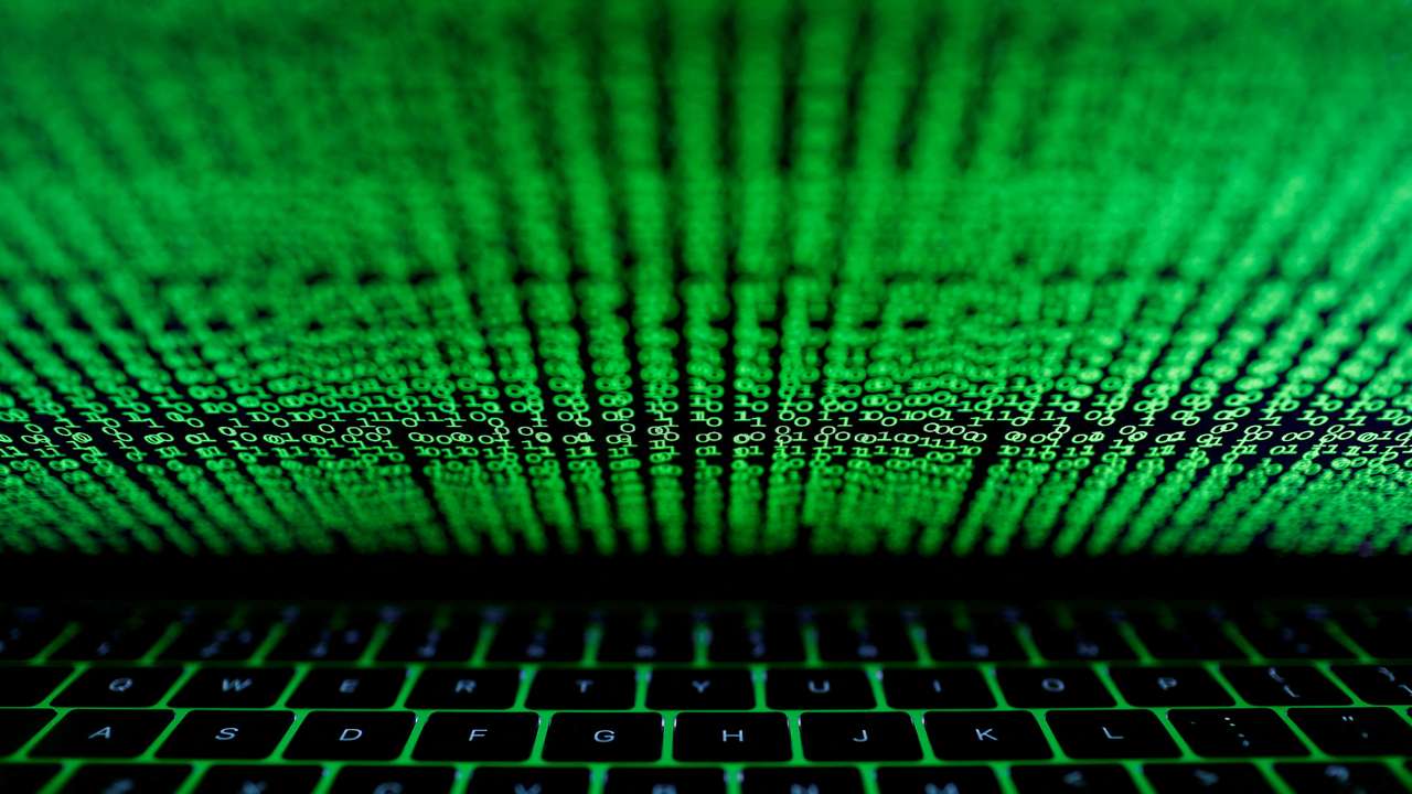 FILE PHOTO: A computer keyboard lit by a displayed cyber code is seen in this illustration picture