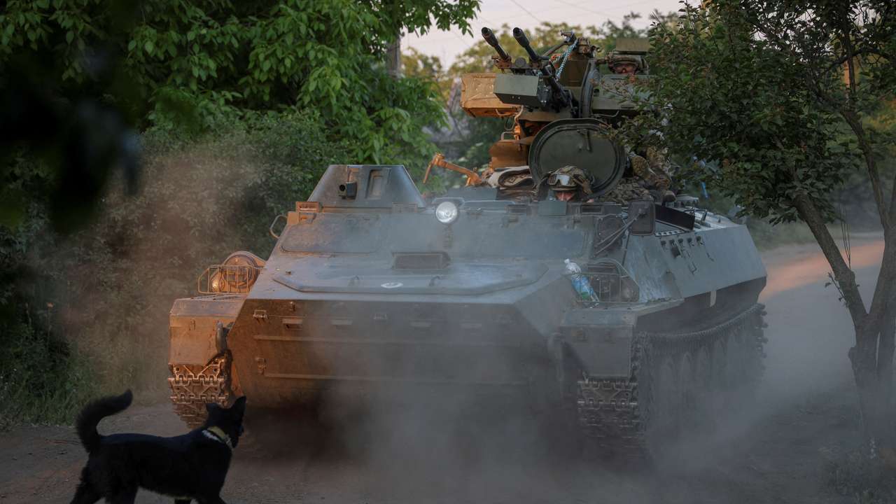 FILE PHOTO: A Ukrainian serviceman rides an APC at a frontline near the town of Bakhmut