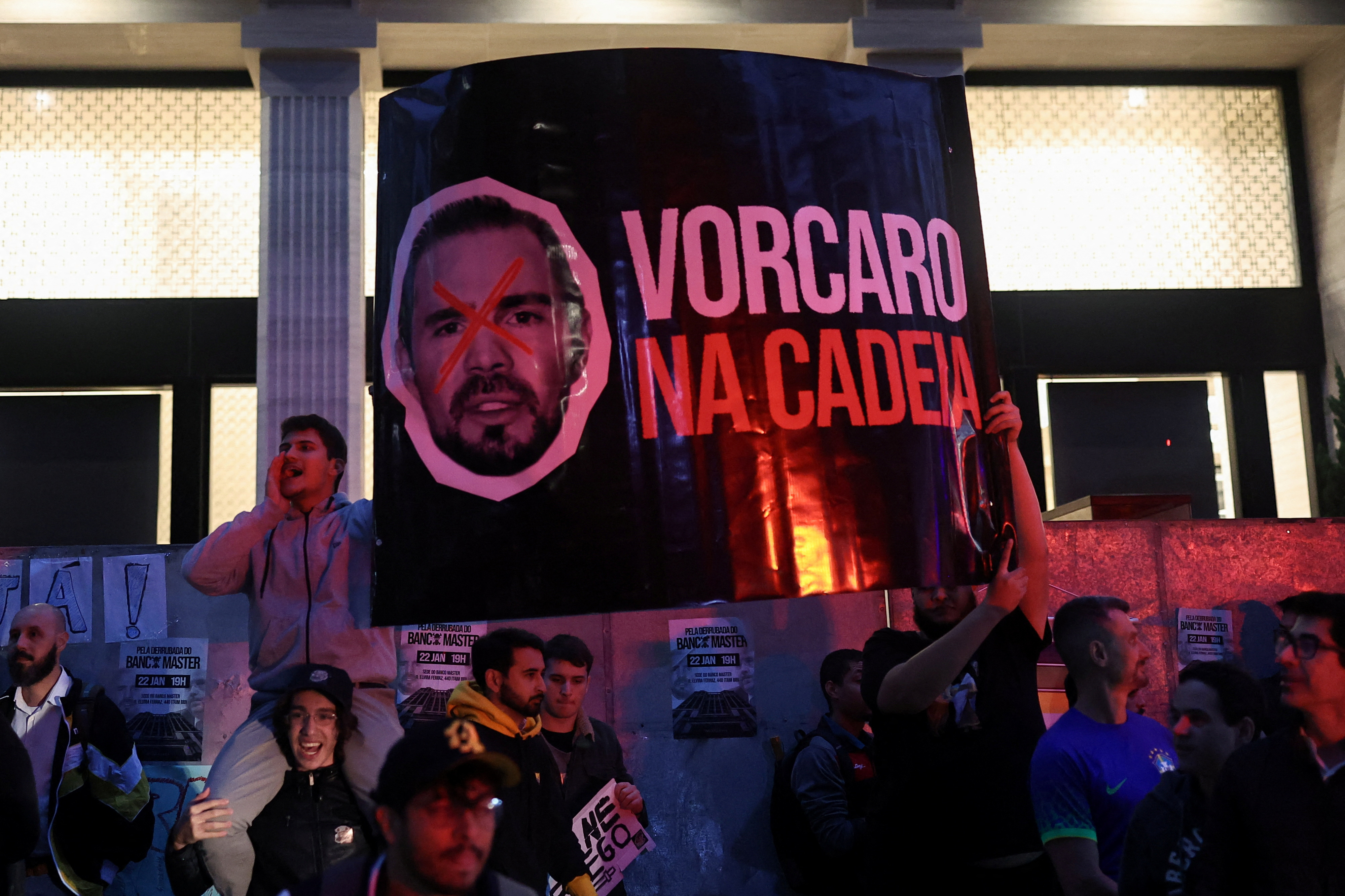 Demonstrators from the right‑wing group Movimento Brasil Livre protest against businessman Daniel Vorcaro outside Banco Master in Sao Paulo