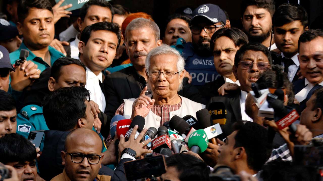 FILE PHOTO: Bangladeshi Nobel peace laureate Professor Muhammad Yunus gestures in front of the court after being sentenced for six months of imprisonment, in Dhaka