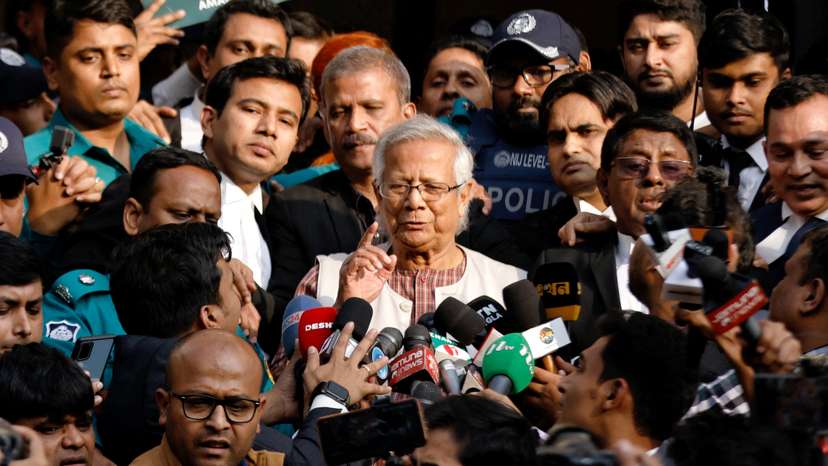 FILE PHOTO: Bangladeshi Nobel peace laureate Professor Muhammad Yunus gestures in front of the court after being sentenced for six months of imprisonment, in Dhaka