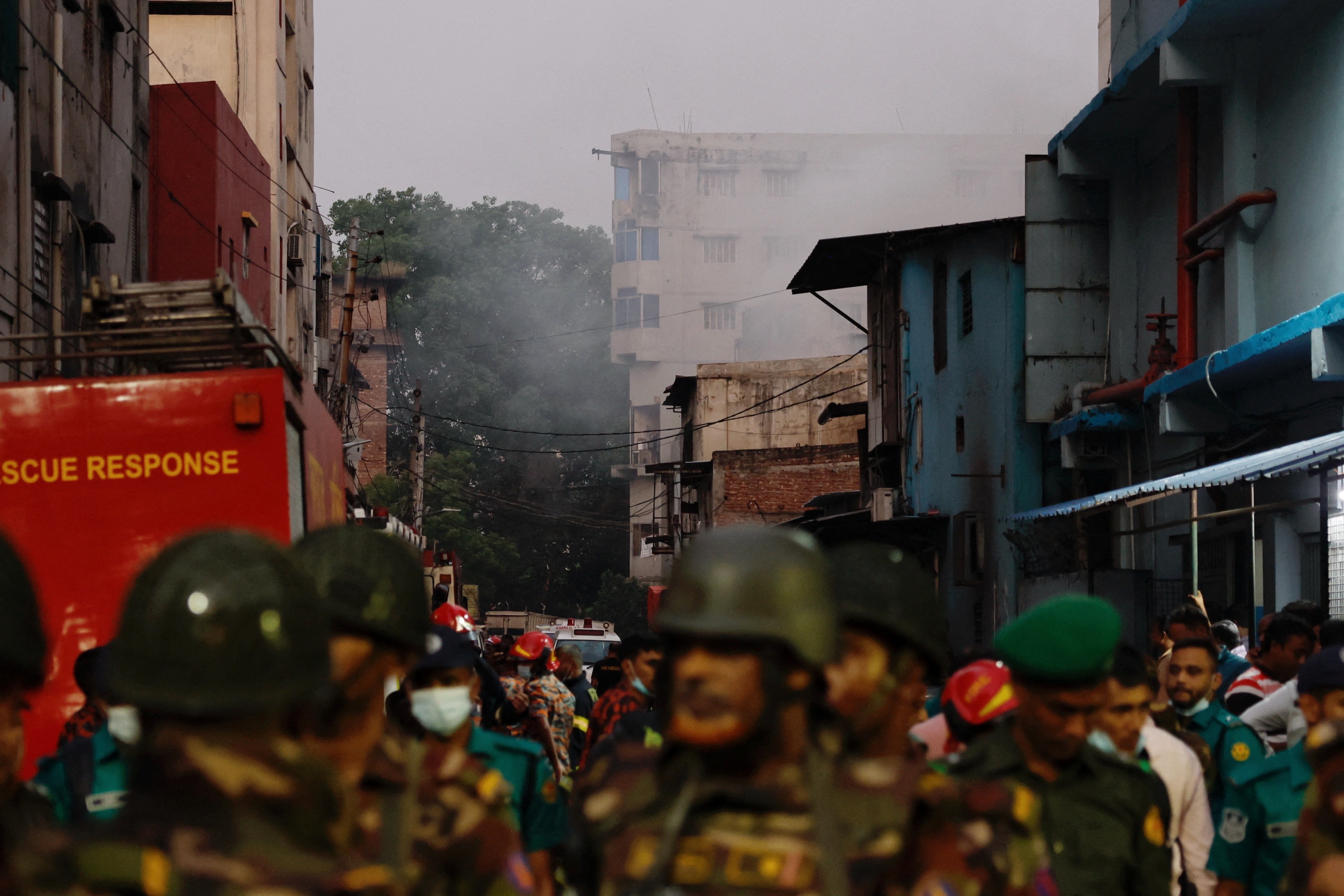 Smoke rises from a building as fore broke out at a garment factory and a chemical warehouse in Dhaka