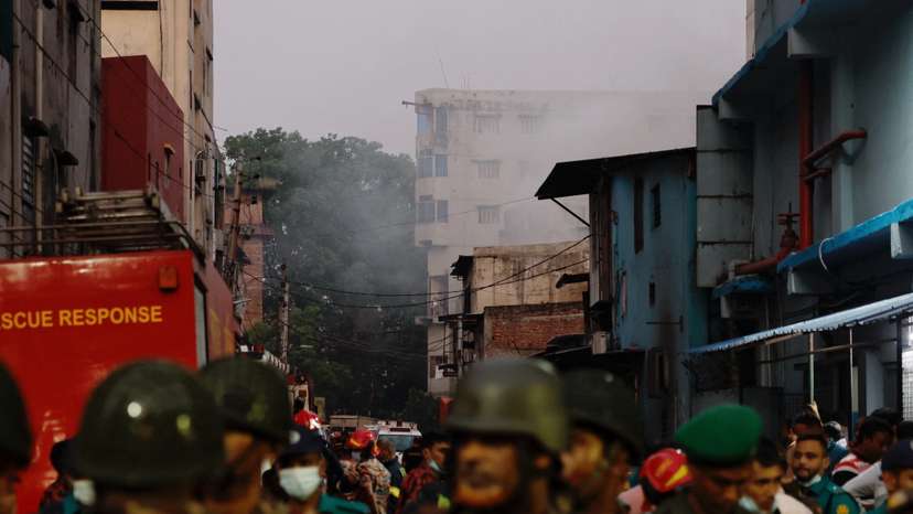Smoke rises from a building as fore broke out at a garment factory and a chemical warehouse in Dhaka