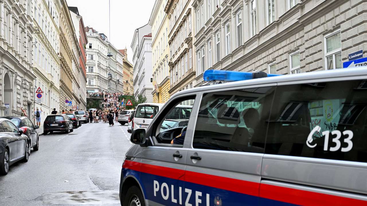 FILE PHOTO: Fans gather after the government confirmed a planned attack at the venue of three Taylor Swift concerts, in Vienna